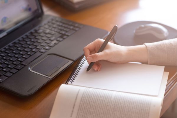 Mindful journaling – woman writing in a notebook